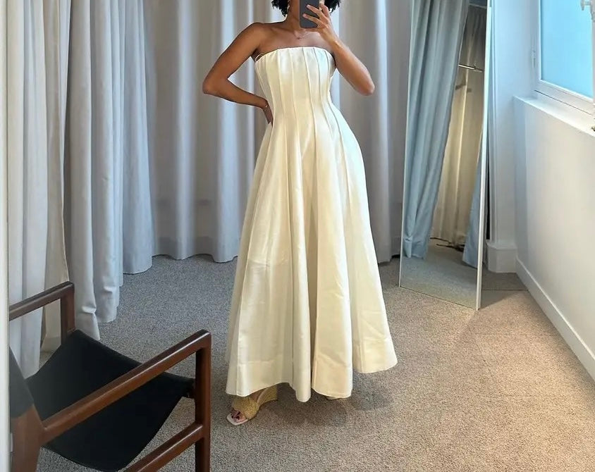 Simple, long, strapless dress.